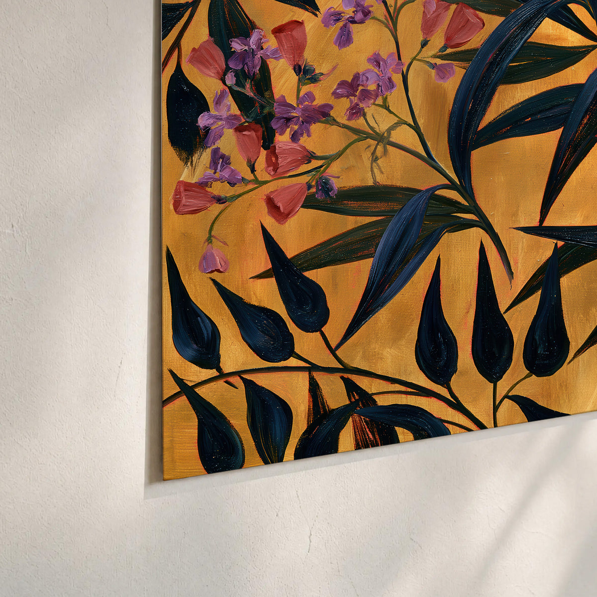 Dark pointed bamboo leaves across an ochre background with small pink floral accents set of 3 poster prints material and edge close up