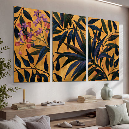 Dark pointed bamboo leaves across an ochre background with small pink floral accents set of 3 poster prints displayed in a console