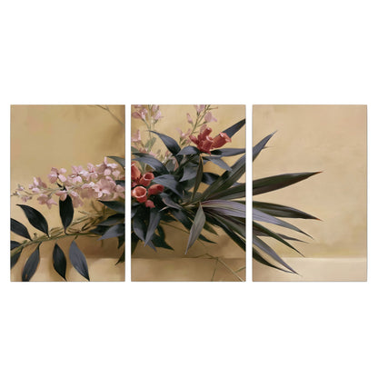 Long dark leaves and dusty pink flowers arranged against a soft beige background 3 piece canvas wall art viewed straight on