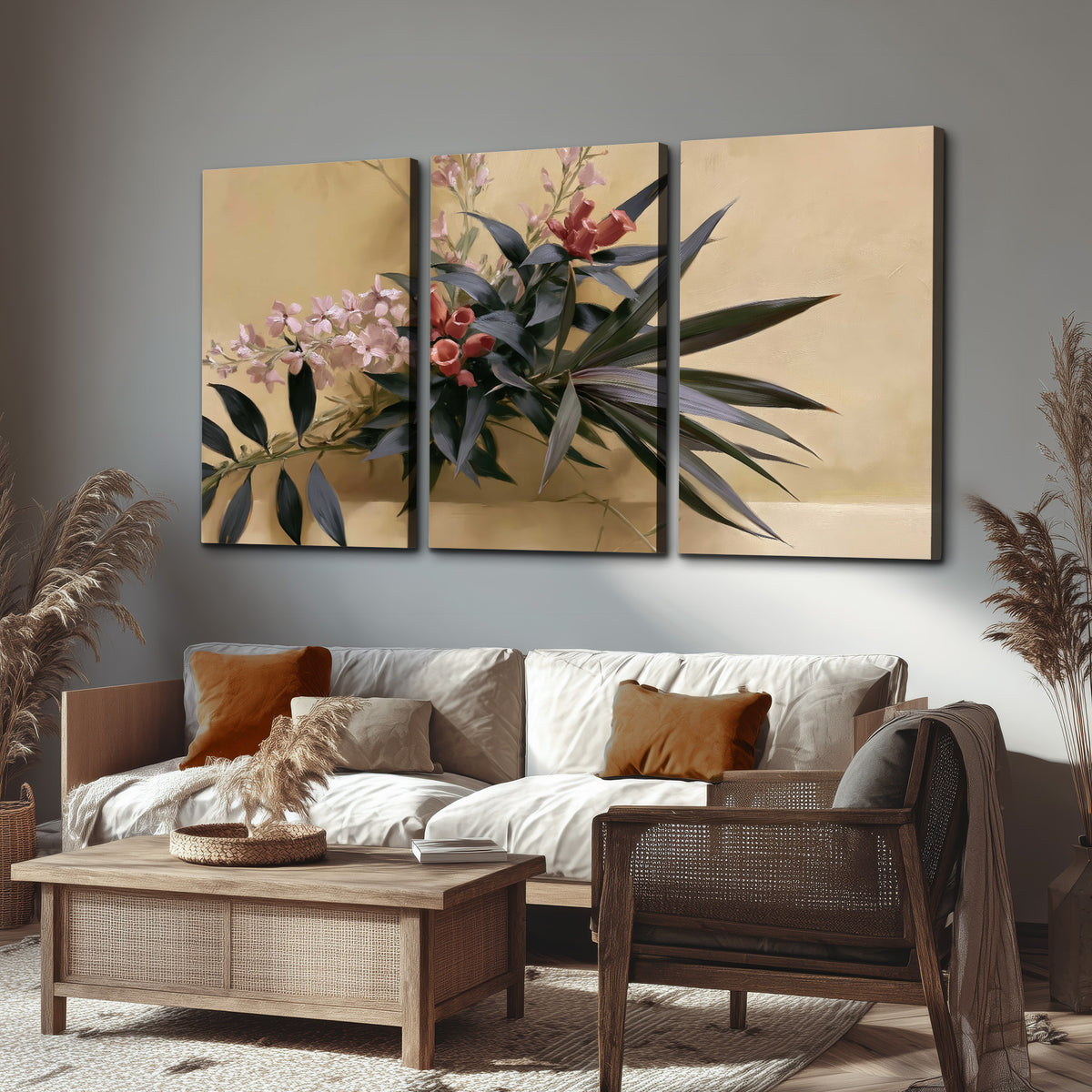 Long dark leaves and dusty pink flowers arranged against a soft beige background 3 piece canvas wall art displayed in a rustic living room