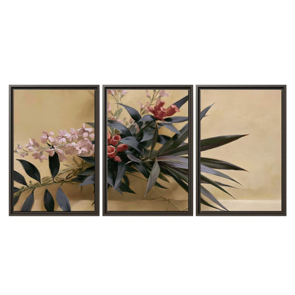 Long dark leaves and dusty pink flowers arranged against a soft beige background 3 piece framed canvas wall art viewed straight on