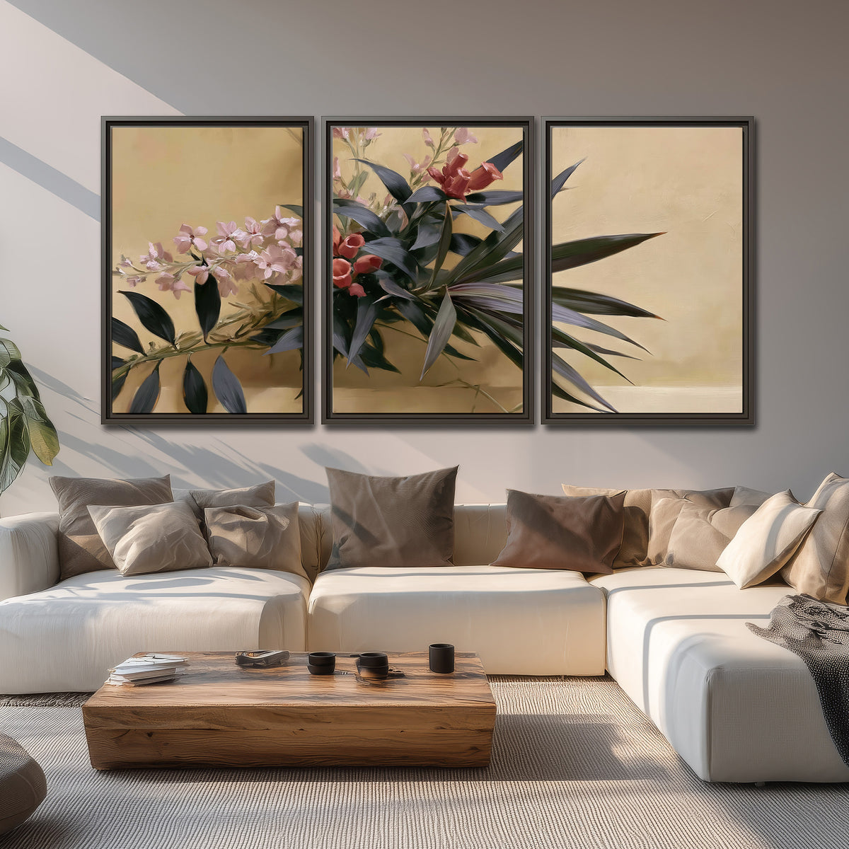 Long dark leaves and dusty pink flowers arranged against a soft beige background 3 piece framed canvas wall art displayed in a living room
