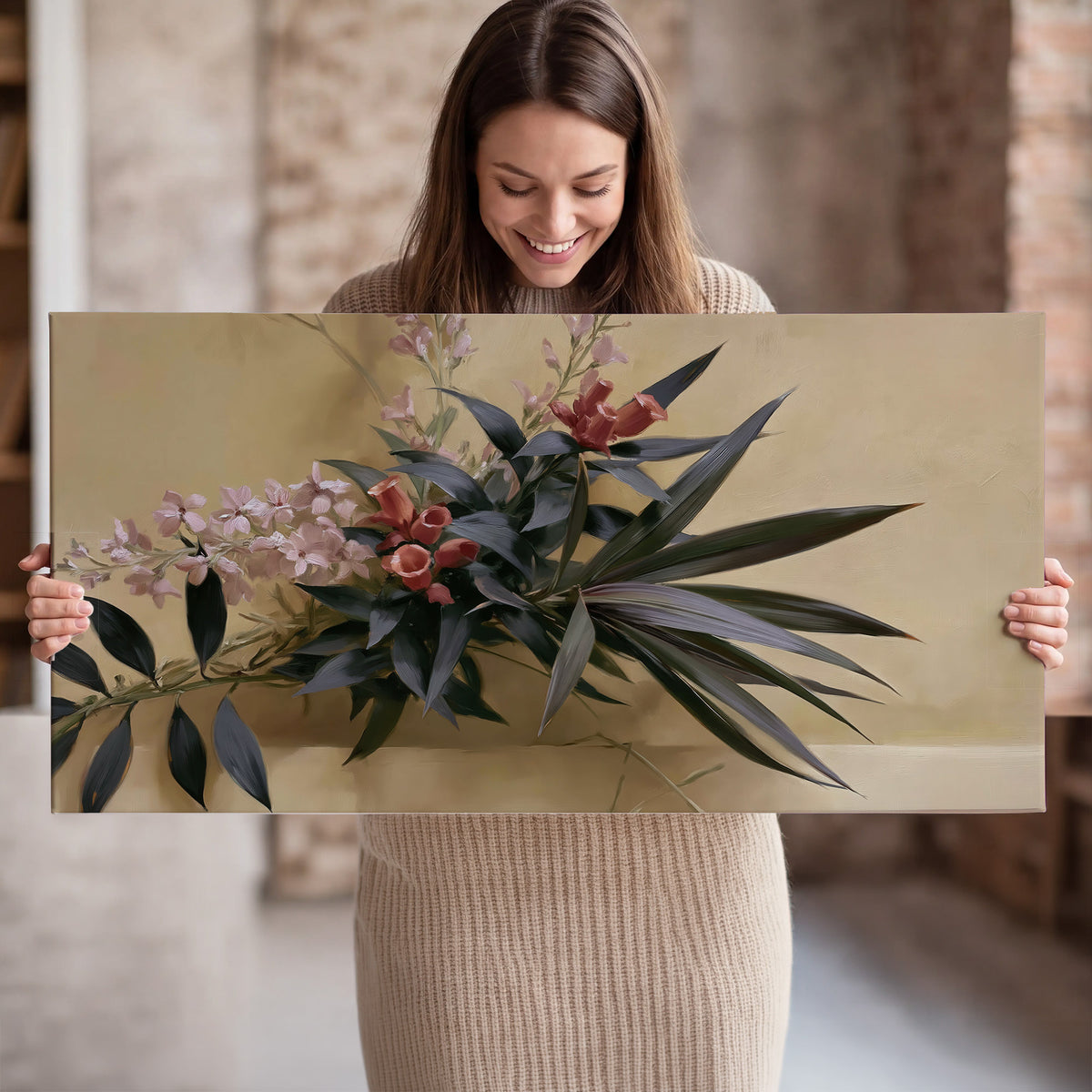 Long dark leaves and dusty pink flowers arranged against a soft beige background single canvas wall art held in hands