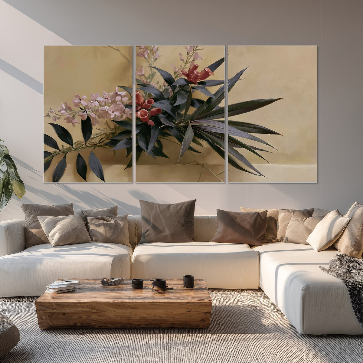 Long dark leaves and dusty pink flowers arranged against a soft beige background set of 3 poster prints displayed in a living room