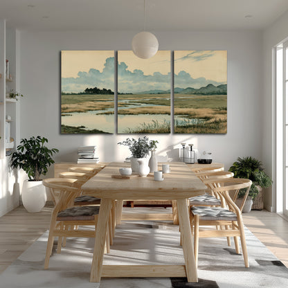A calm marshland with reflective pools and distant blue-green hills under a clouded sky 3 piece canvas wall art room and product view