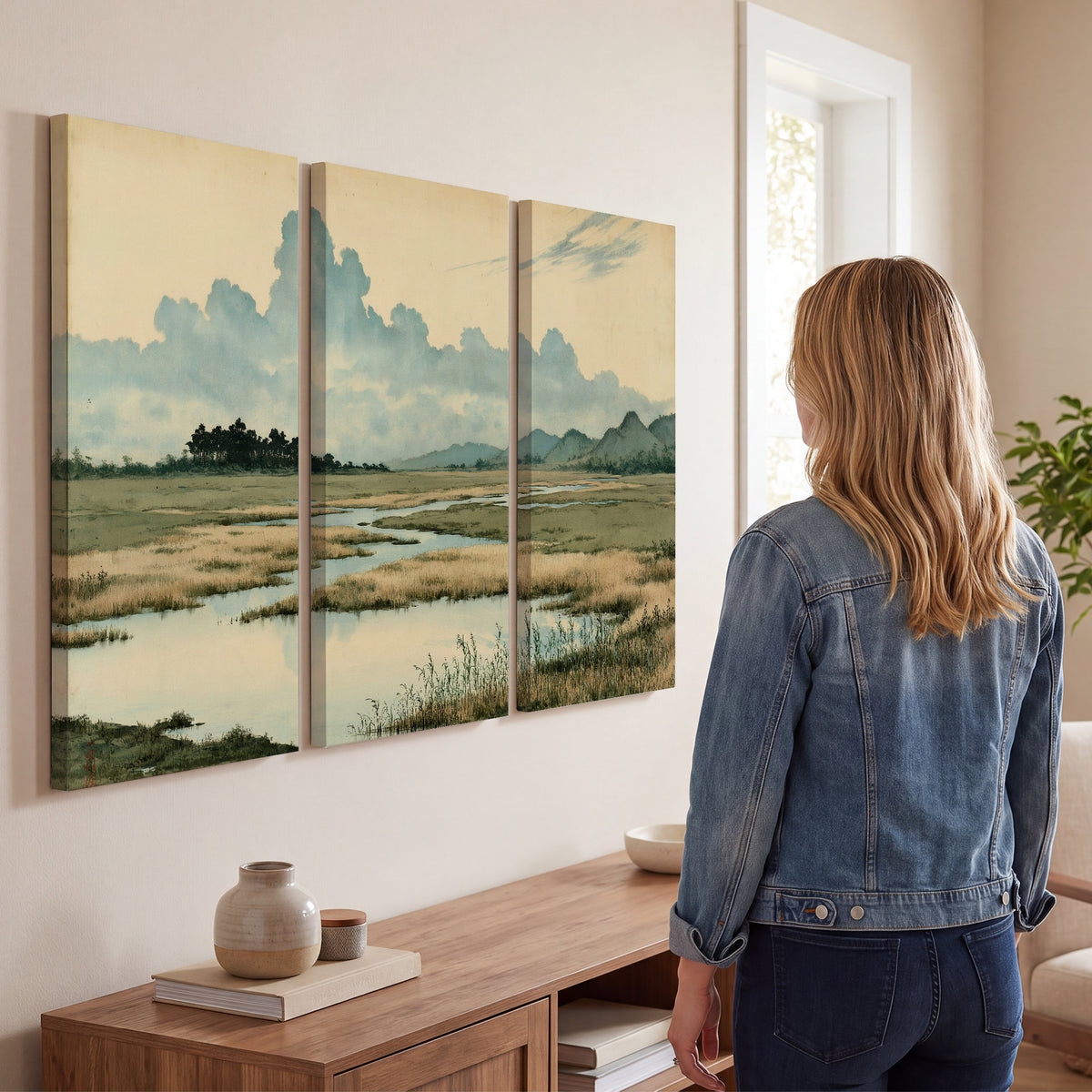 A calm marshland with reflective pools and distant blue-green hills under a clouded sky 3 piece canvas wall art three panel arrangement on a wall