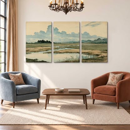 A calm marshland with reflective pools and distant blue-green hills under a clouded sky 3 piece canvas wall art styled in an interior