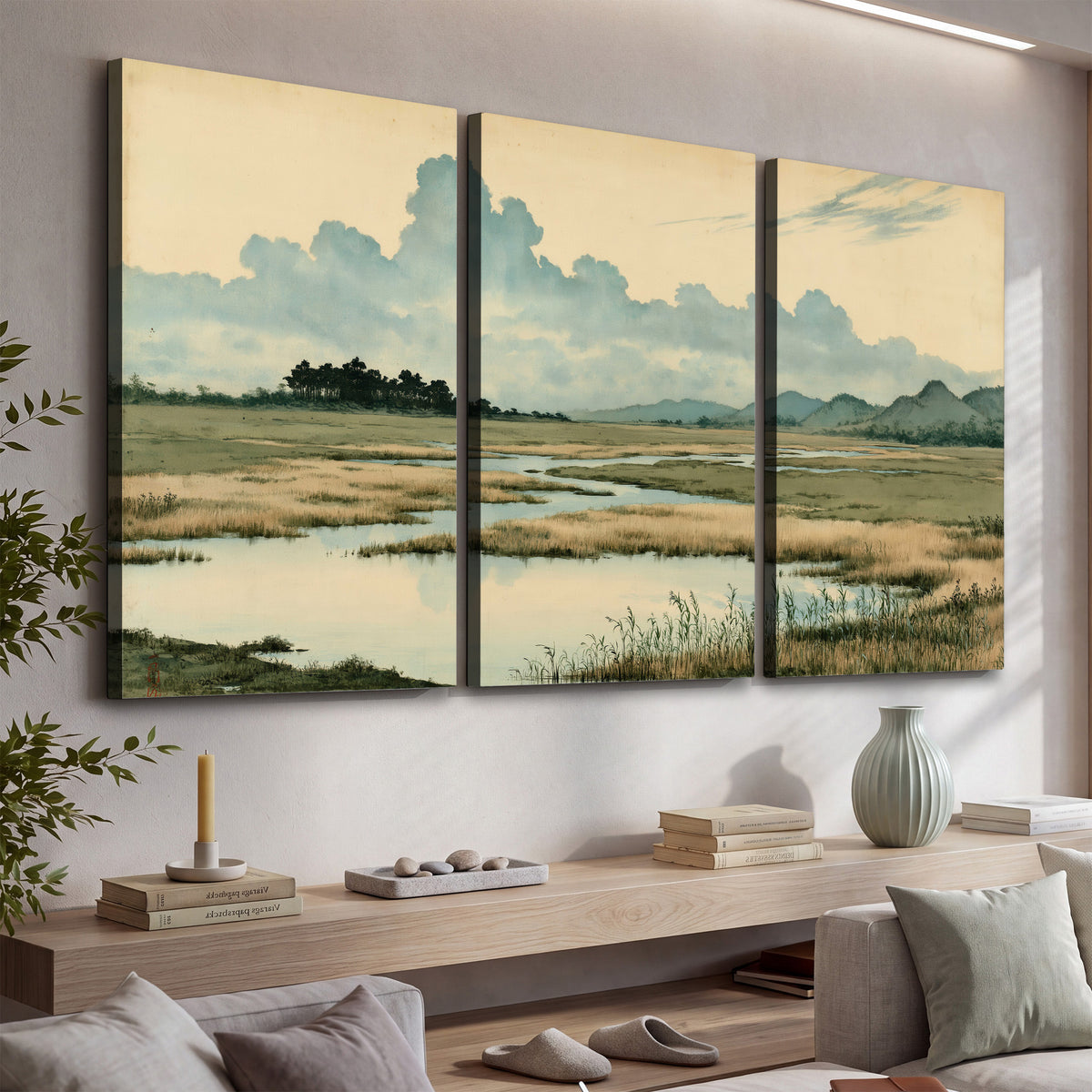 A calm marshland with reflective pools and distant blue-green hills under a clouded sky 3 piece canvas wall art displayed in a console