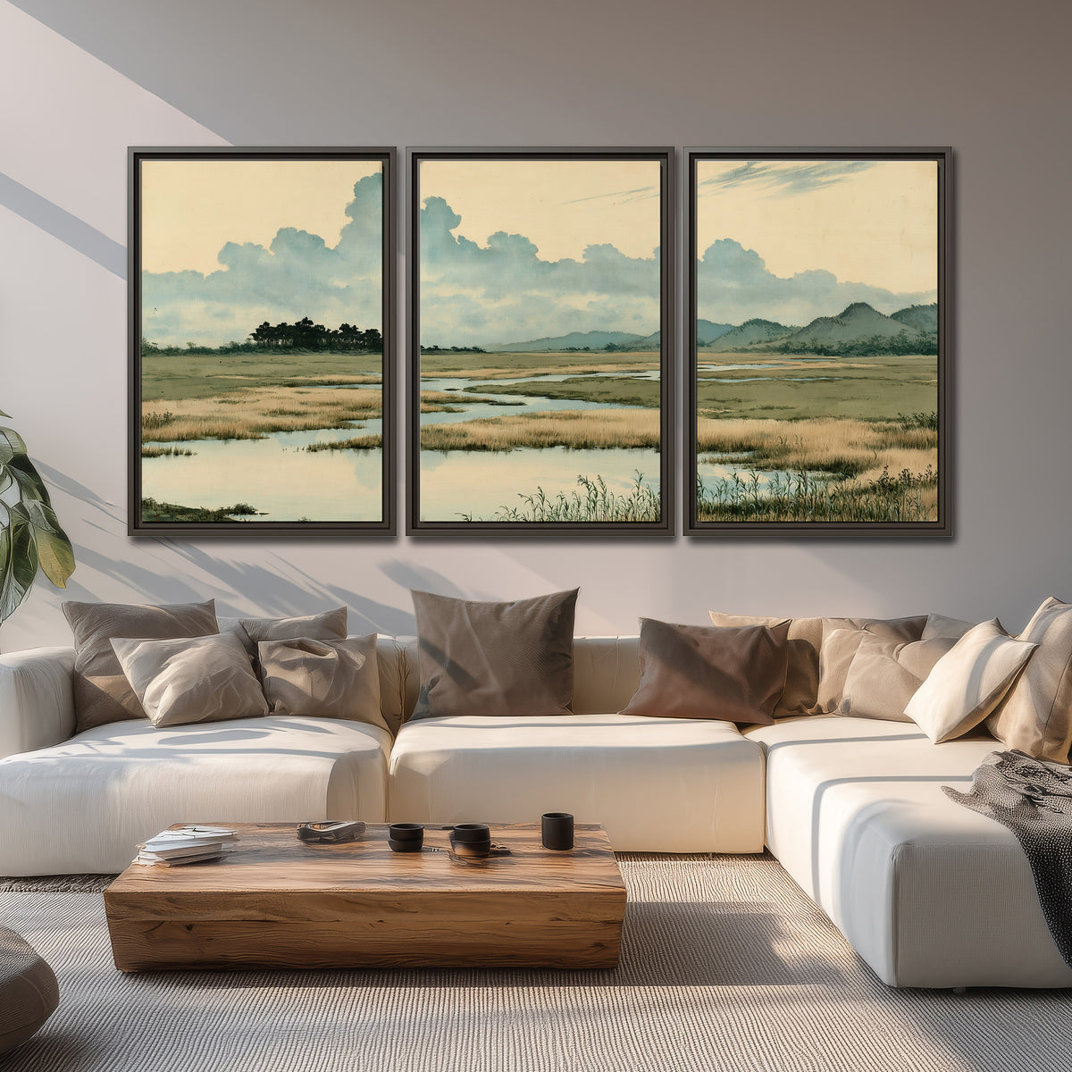 A calm marshland with reflective pools and distant blue-green hills under a clouded sky 3 piece framed canvas wall art displayed in a living room