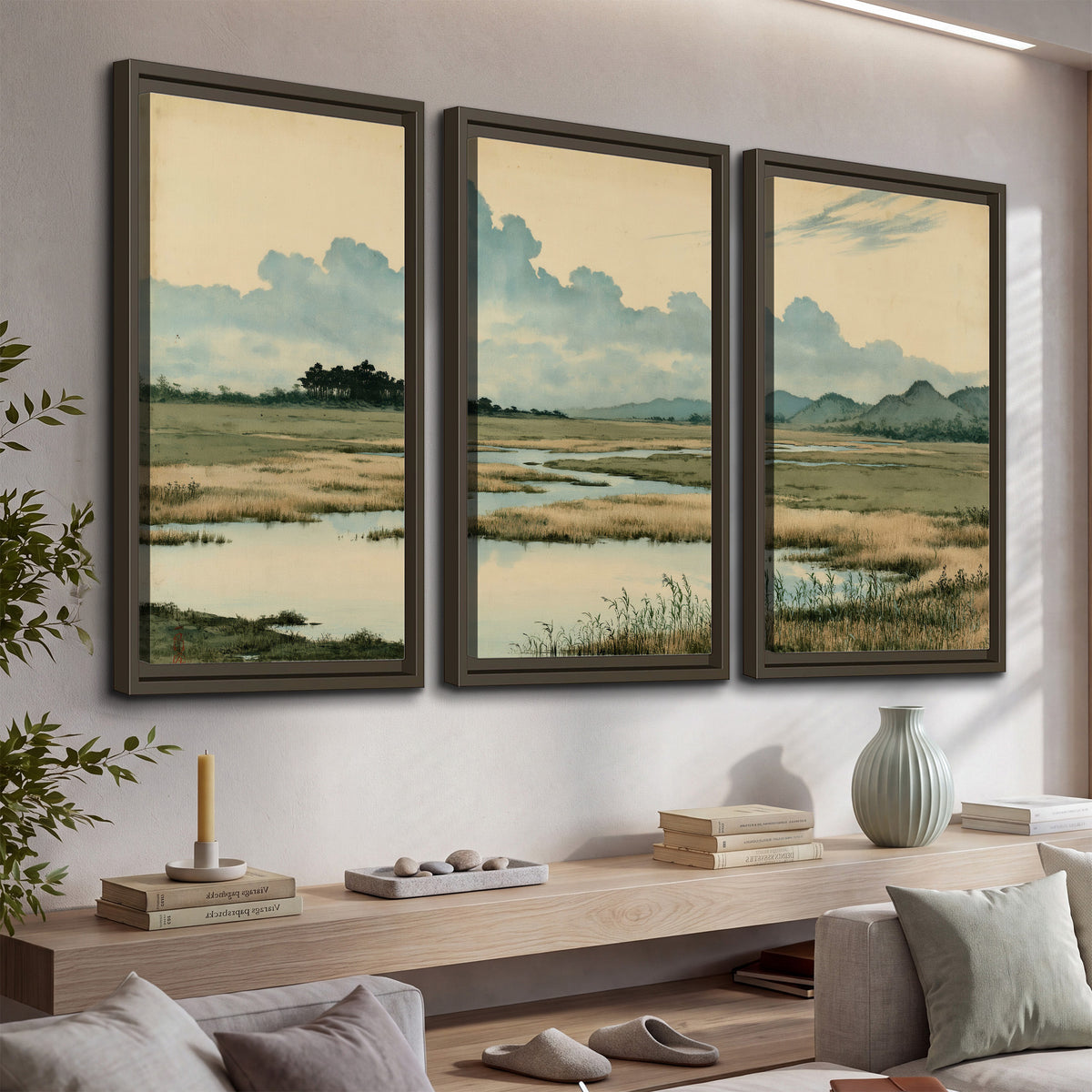 A calm marshland with reflective pools and distant blue-green hills under a clouded sky 3 piece framed canvas wall art displayed in a console