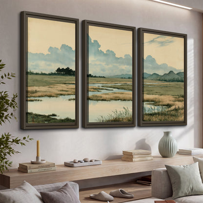 A calm marshland with reflective pools and distant blue-green hills under a clouded sky 3 piece framed canvas wall art displayed in a console