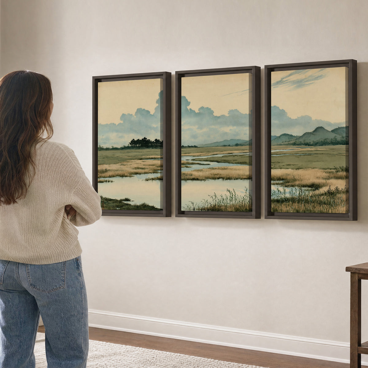 A calm marshland with reflective pools and distant blue-green hills under a clouded sky 3 piece framed canvas wall art three panel arrangement on a wall