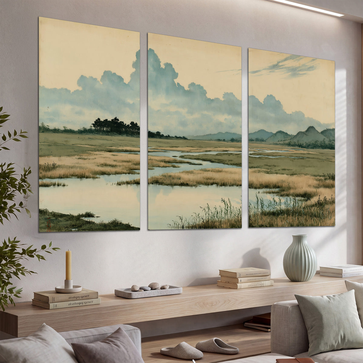 A calm marshland with reflective pools and distant blue-green hills under a clouded sky set of 3 poster prints displayed in a console