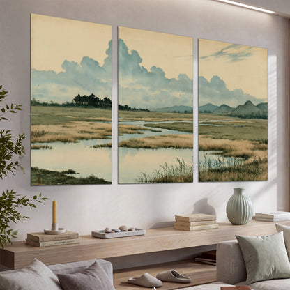 A calm marshland with reflective pools and distant blue-green hills under a clouded sky set of 3 poster prints displayed in a console