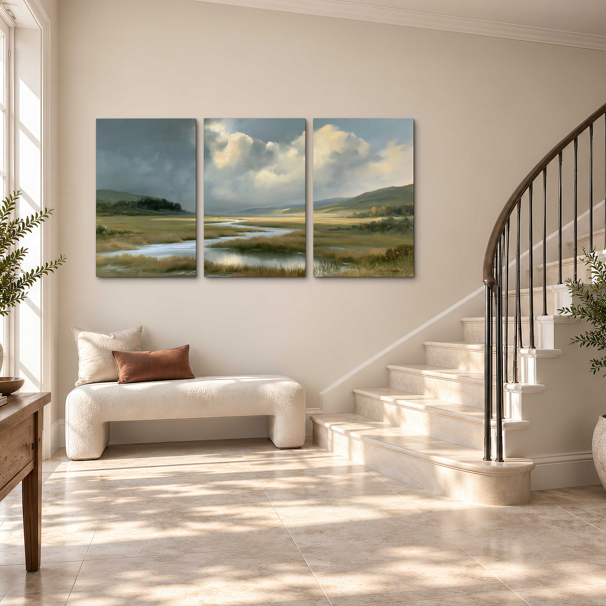 A winding stream through an open meadow beneath large sunlit clouds 3 piece canvas wall art styled in an interior