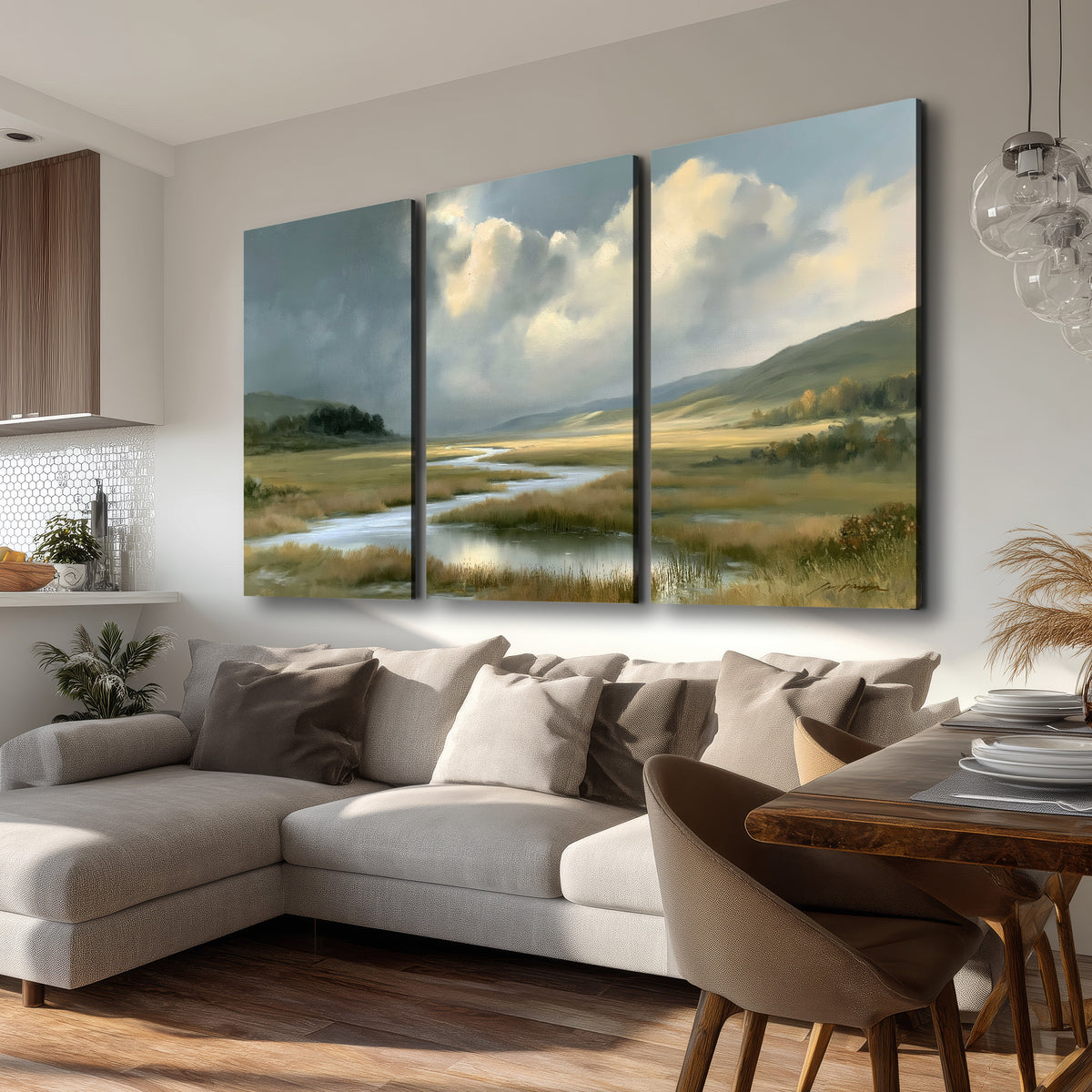 A winding stream through an open meadow beneath large sunlit clouds 3 piece canvas wall art room and product view