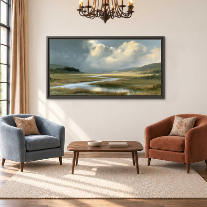 A winding stream through an open meadow beneath large sunlit clouds single framed canvas wall art styled in an interior