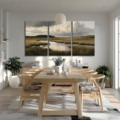 Pools of still water reflecting a dramatic cloud-filled sky across a golden marsh 3 piece canvas wall art room and product view