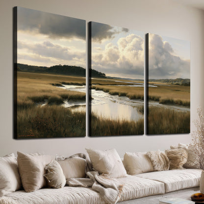 Pools of still water reflecting a dramatic cloud-filled sky across a golden marsh 3 piece canvas wall art room and product view