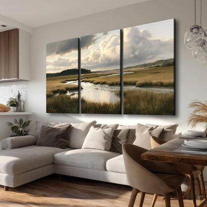 Pools of still water reflecting a dramatic cloud-filled sky across a golden marsh 3 piece canvas wall art room and product view