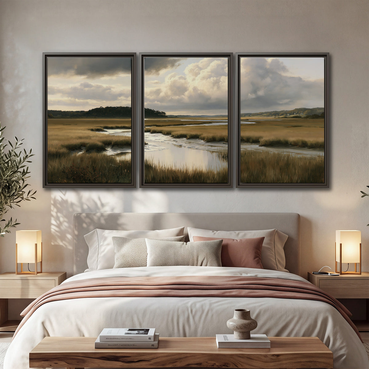 Pools of still water reflecting a dramatic cloud-filled sky across a golden marsh 3 piece framed canvas wall art displayed in a bedroom