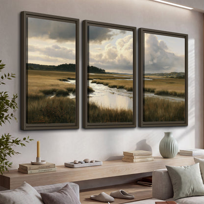 Pools of still water reflecting a dramatic cloud-filled sky across a golden marsh 3 piece framed canvas wall art displayed in a console