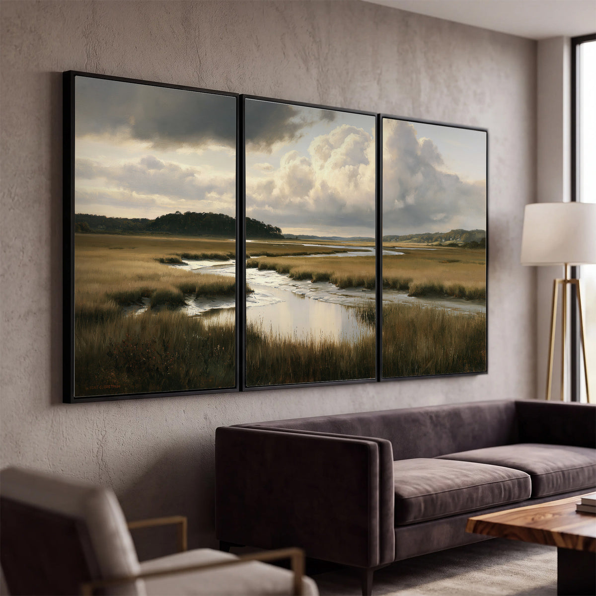 Pools of still water reflecting a dramatic cloud-filled sky across a golden marsh 3 piece framed canvas wall art displayed in a modern living room