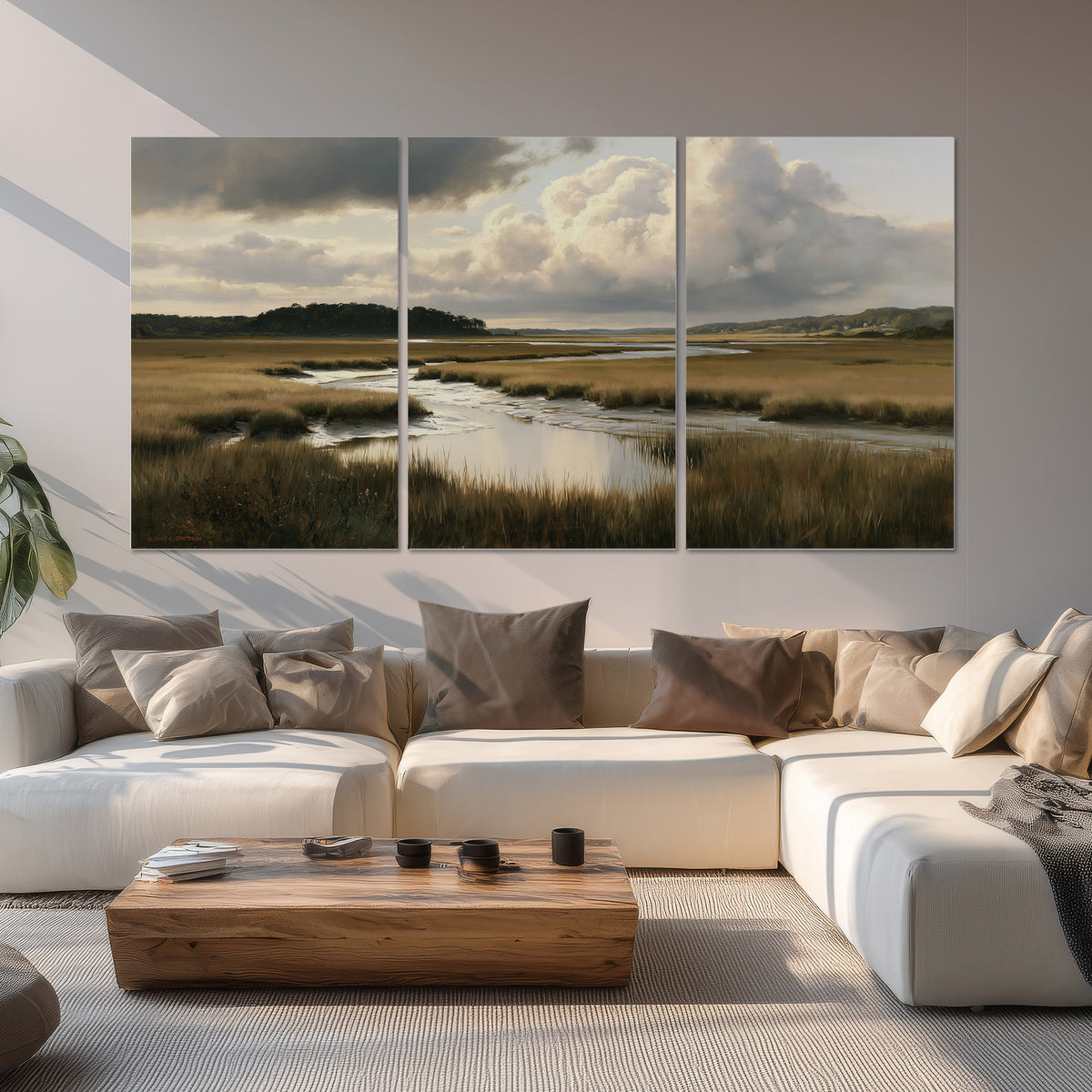 Pools of still water reflecting a dramatic cloud-filled sky across a golden marsh set of 3 poster prints displayed in a living room