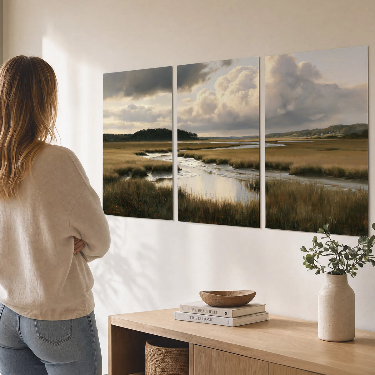 Pools of still water reflecting a dramatic cloud-filled sky across a golden marsh set of 3 poster prints three panel arrangement on a wall
