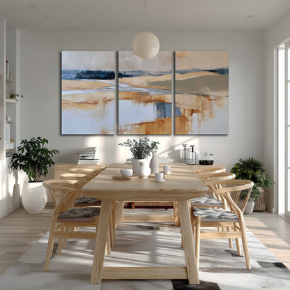 Soft horizontal bands of blue, ochre and ivory suggesting a reflected marsh landscape 3 piece canvas wall art room and product view