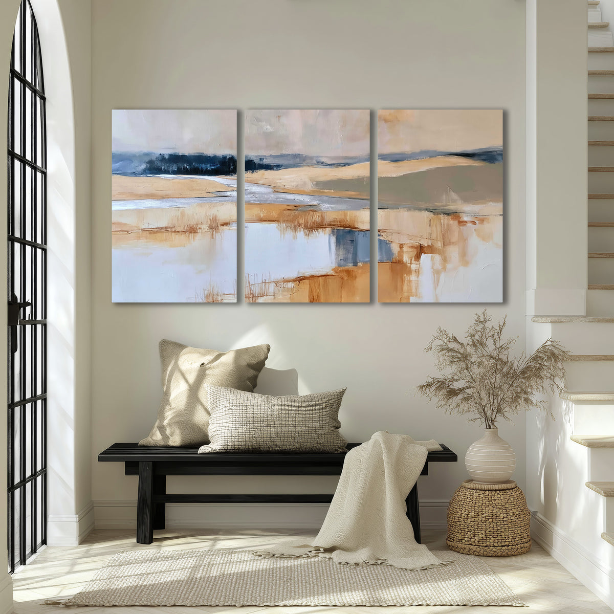 Soft horizontal bands of blue, ochre and ivory suggesting a reflected marsh landscape 3 piece canvas wall art displayed in a entryway