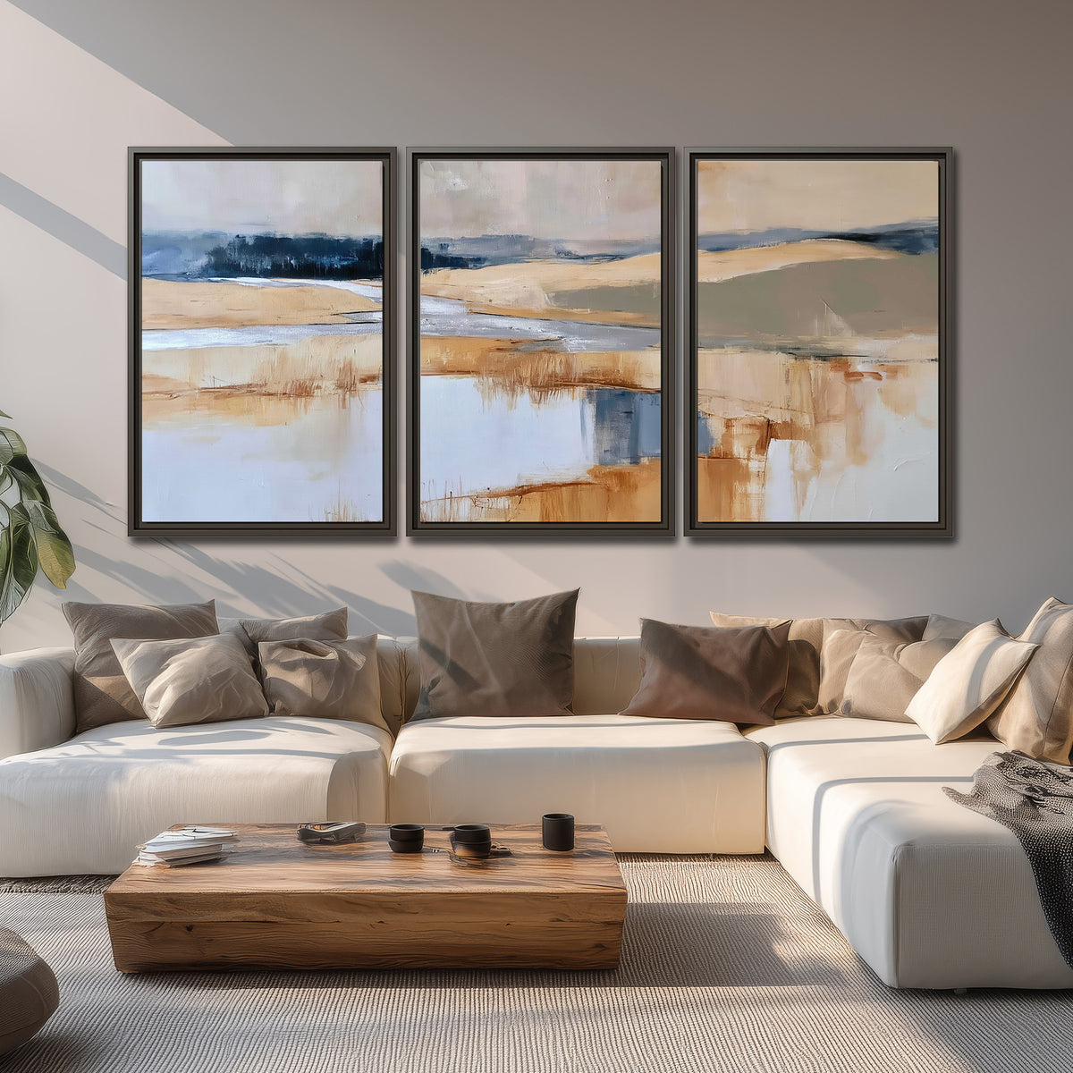 Soft horizontal bands of blue, ochre and ivory suggesting a reflected marsh landscape 3 piece framed canvas wall art displayed in a living room