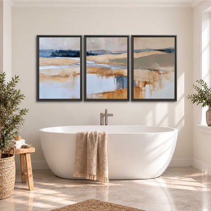 Soft horizontal bands of blue, ochre and ivory suggesting a reflected marsh landscape 3 piece framed canvas wall art styled in an interior