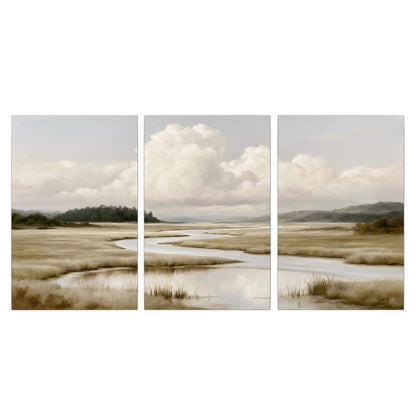 A pale winding waterway crossing quiet wetlands beneath billowing white clouds 3 piece canvas wall art viewed straight on
