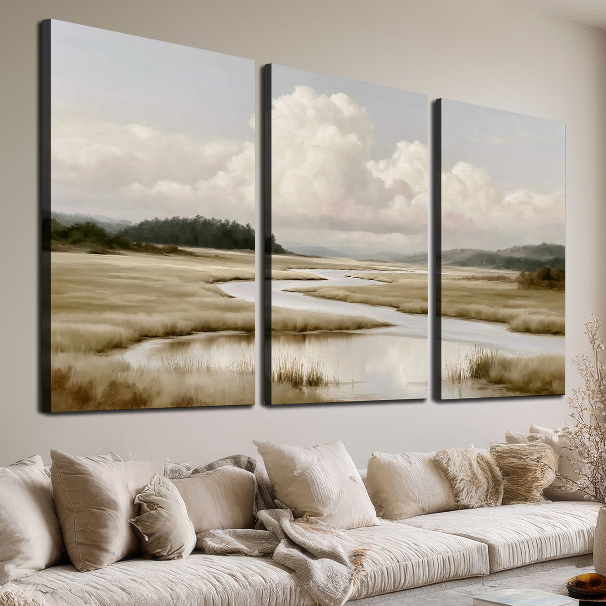 A pale winding waterway crossing quiet wetlands beneath billowing white clouds 3 piece canvas wall art room and product view