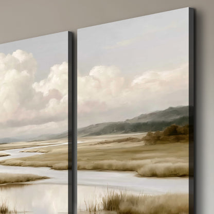 A pale winding waterway crossing quiet wetlands beneath billowing white clouds 3 piece canvas wall art room and product view