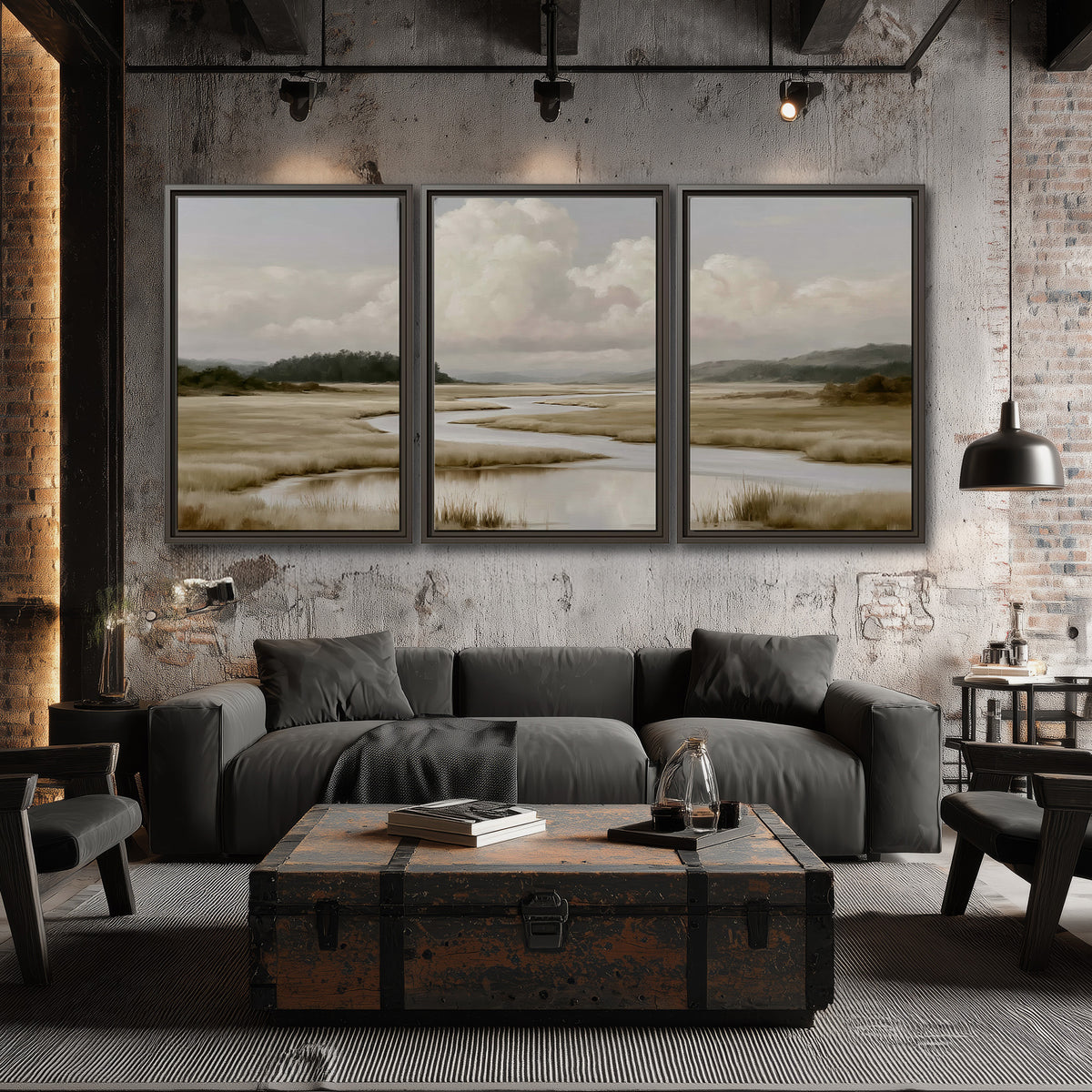 A pale winding waterway crossing quiet wetlands beneath billowing white clouds 3 piece framed canvas wall art displayed in a industrial room