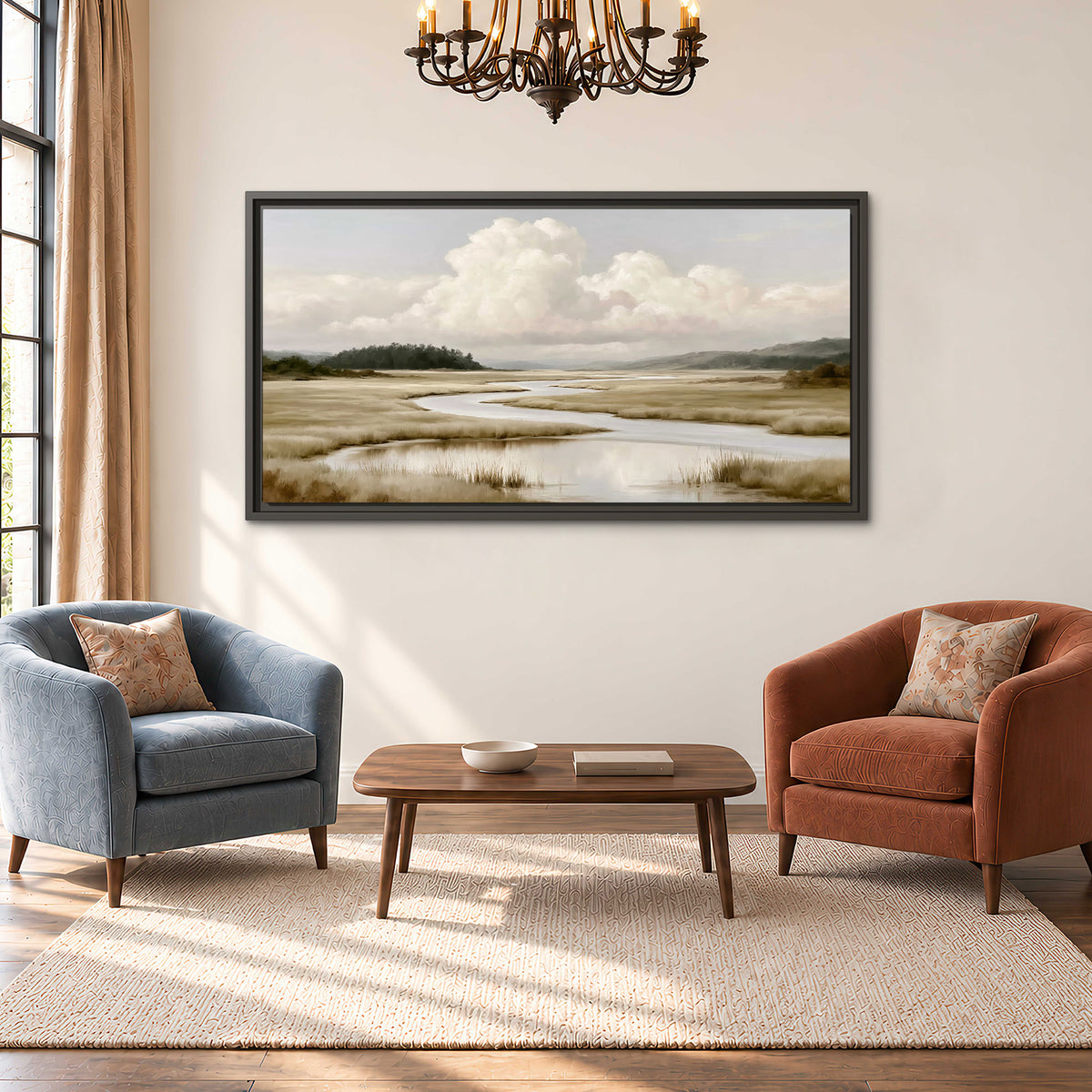 A pale winding waterway crossing quiet wetlands beneath billowing white clouds single framed canvas wall art styled in an interior