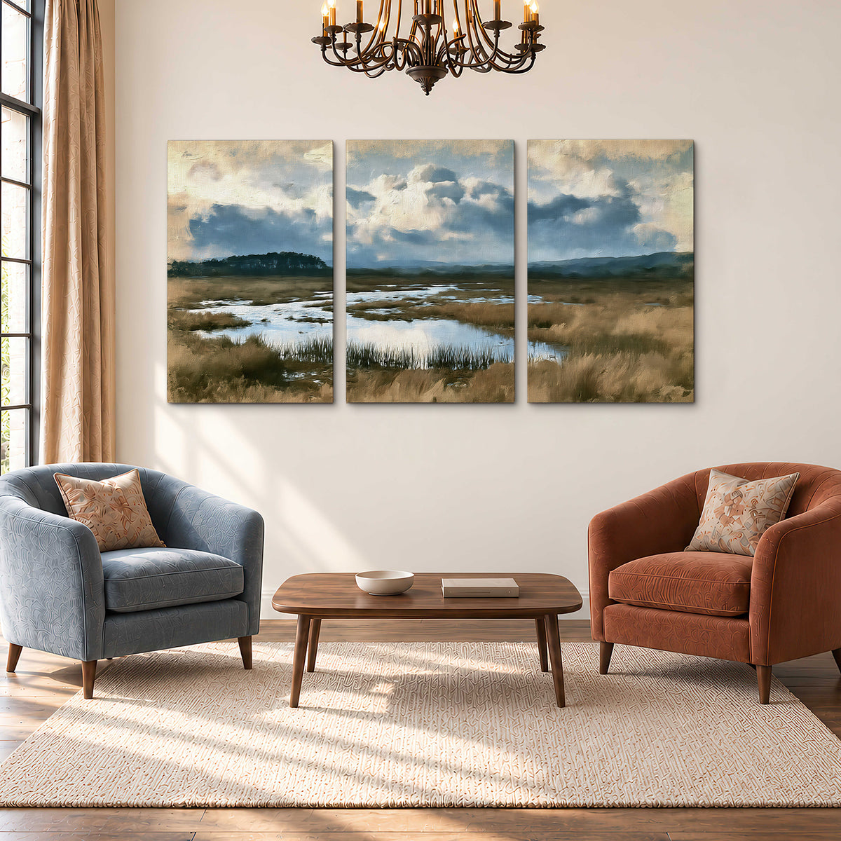 A wide open marsh with blue water and warm grasses beneath layered clouds 3 piece canvas wall art styled in an interior
