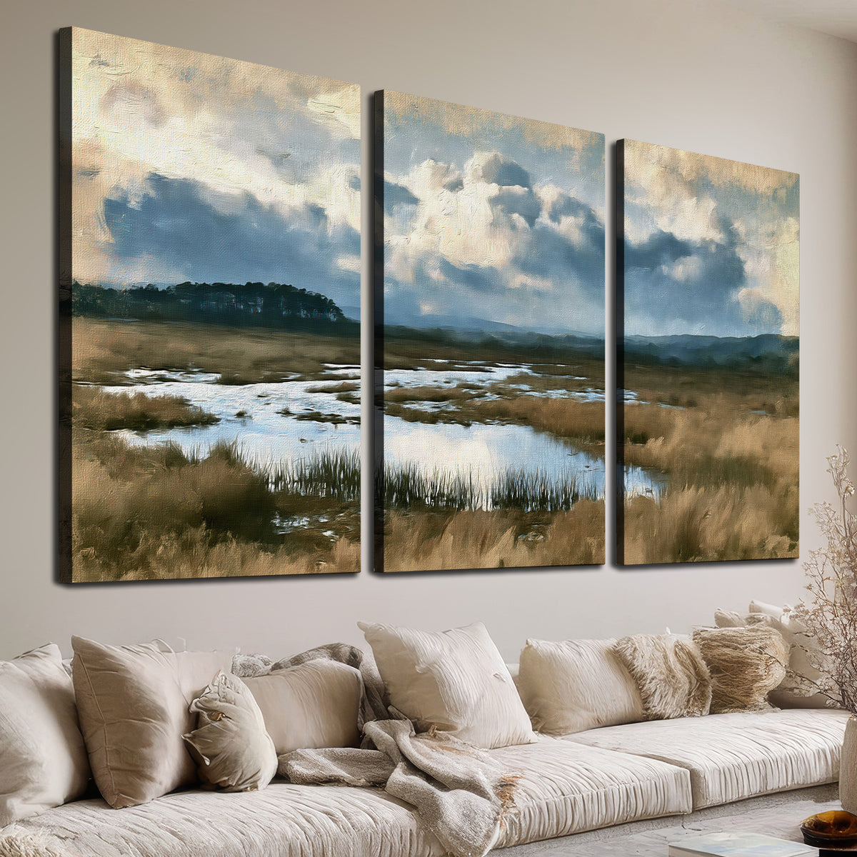 A wide open marsh with blue water and warm grasses beneath layered clouds 3 piece canvas wall art room and product view