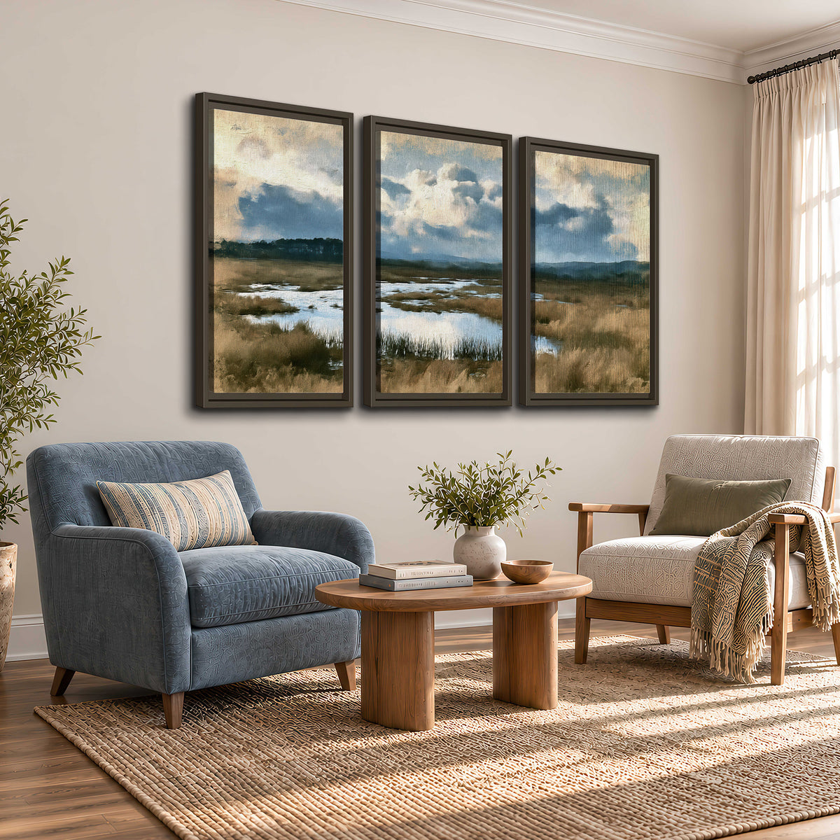 A wide open marsh with blue water and warm grasses beneath layered clouds 3 piece framed canvas wall art styled in an interior