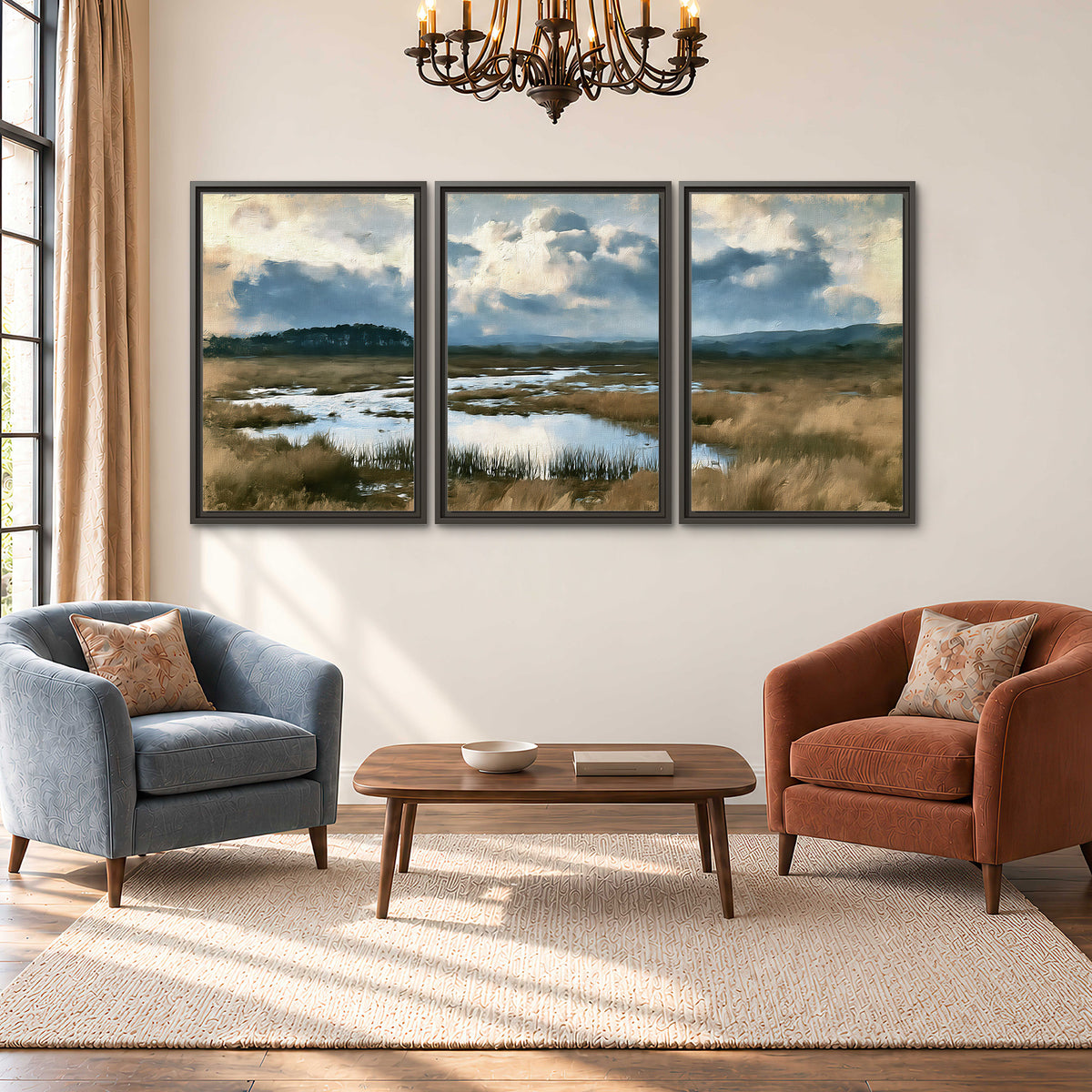 A wide open marsh with blue water and warm grasses beneath layered clouds 3 piece framed canvas wall art styled in an interior