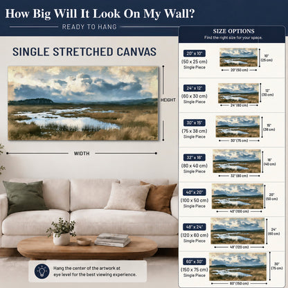 A wide open marsh with blue water and warm grasses beneath layered clouds single canvas wall art size guide above a sofa; room view is illustrative
