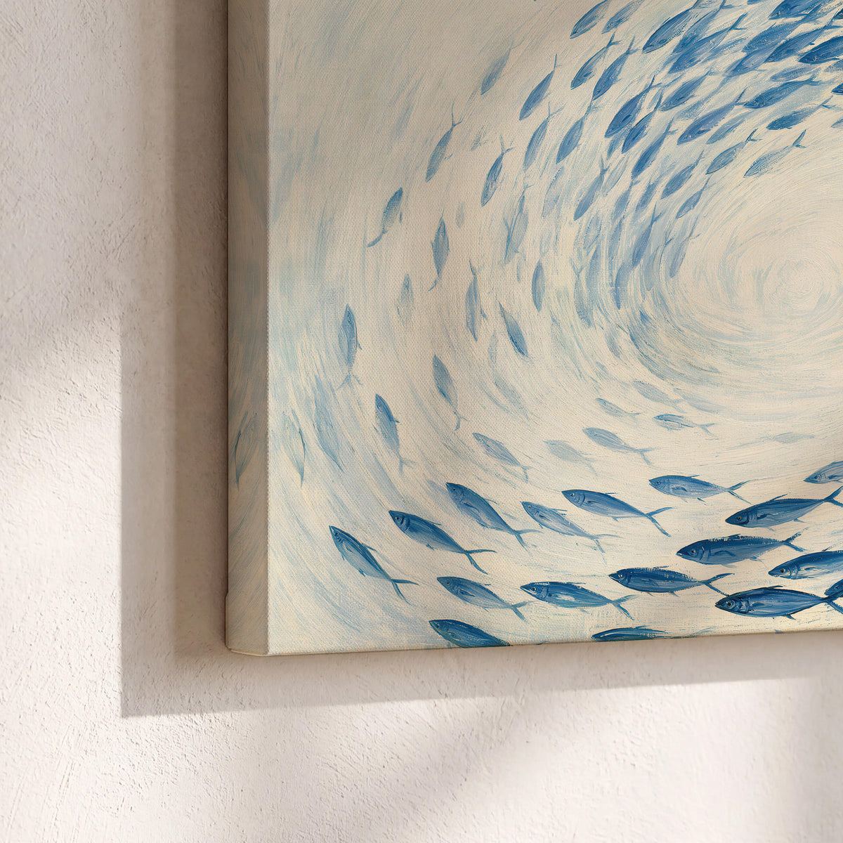 A circular school of blue fish flowing around a pale open center 3 piece canvas wall art material and edge close up