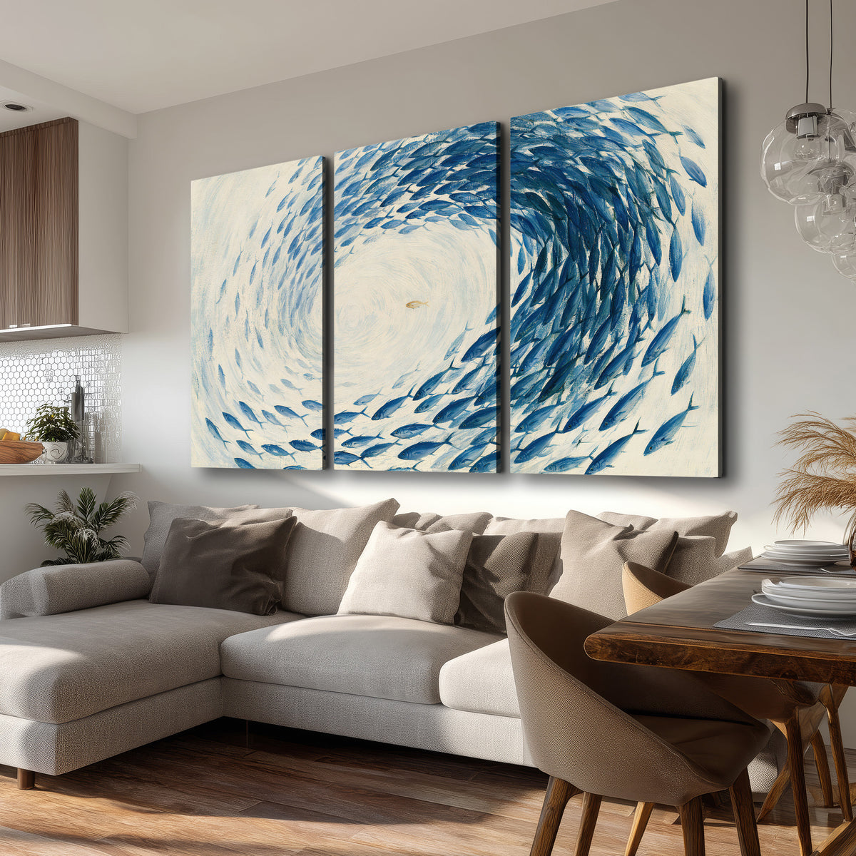 A circular school of blue fish flowing around a pale open center 3 piece canvas wall art room and product view