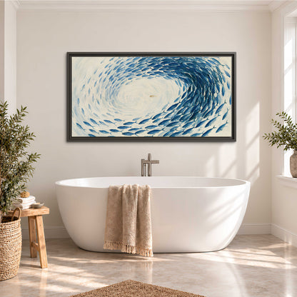 A circular school of blue fish flowing around a pale open center single framed canvas wall art styled in an interior