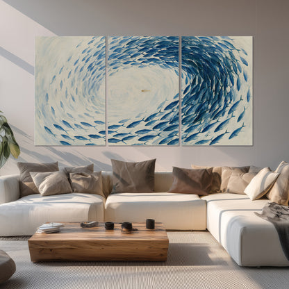 A circular school of blue fish flowing around a pale open center set of 3 poster prints displayed in a living room