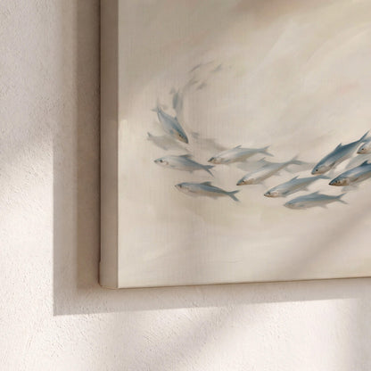 A sweeping school of small gray fish curving across a pale neutral background 3 piece canvas wall art material and edge close up