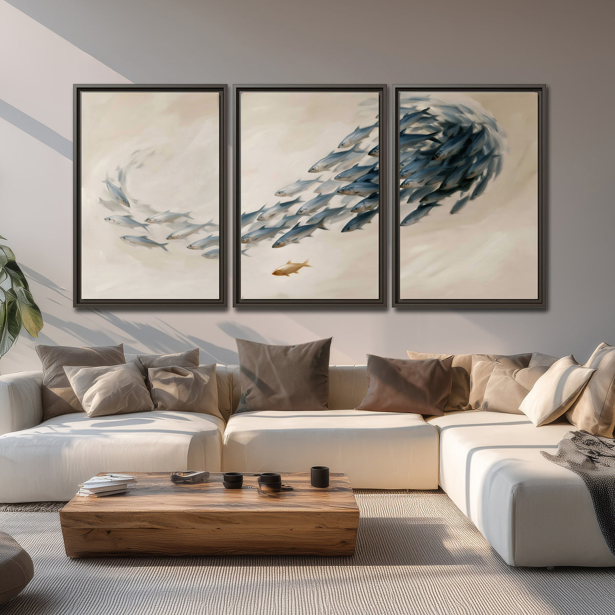 A sweeping school of small gray fish curving across a pale neutral background 3 piece framed canvas wall art displayed in a living room