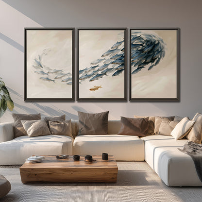 A sweeping school of small gray fish curving across a pale neutral background 3 piece framed canvas wall art displayed in a living room